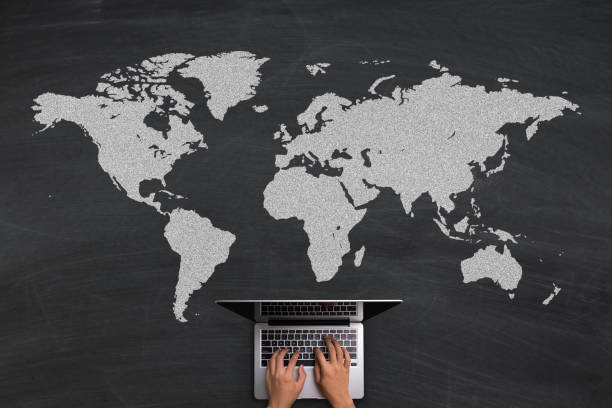 istock Global Business Concept With Laptop On Blackboard 696640344