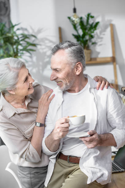istock Loving senior couple converse together 696640546