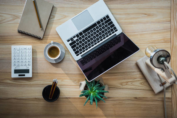 istock Top view of modern office workplace with laptop 696640680