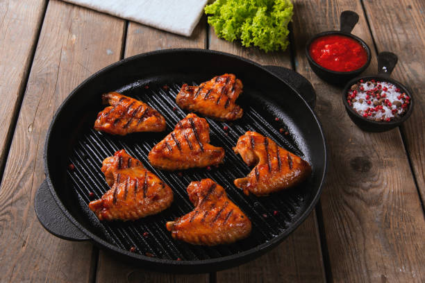 istock Fried chicken wings grill on grill pan 696643462