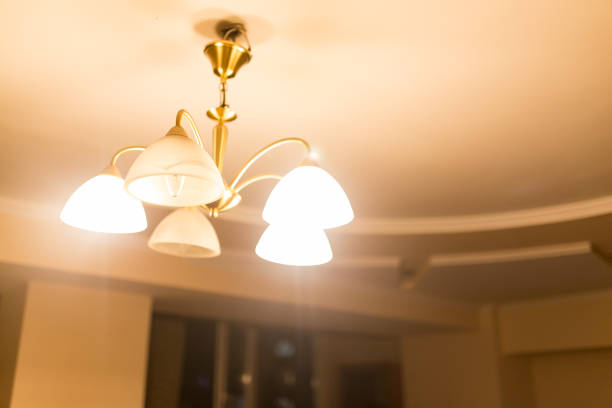 istock Burning lamps in a chandelier 696647186