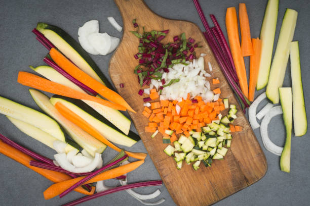 istock chopped vegetables on wooden board 696654260