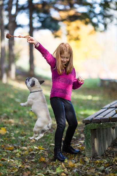 istock Little girl and dog 696654464