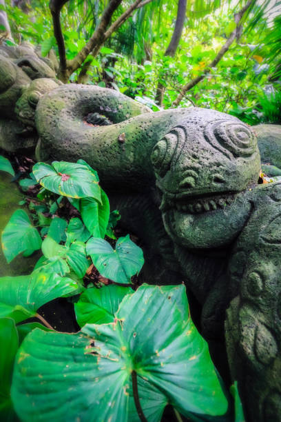 istock Balinese snake statue in forest 696655592