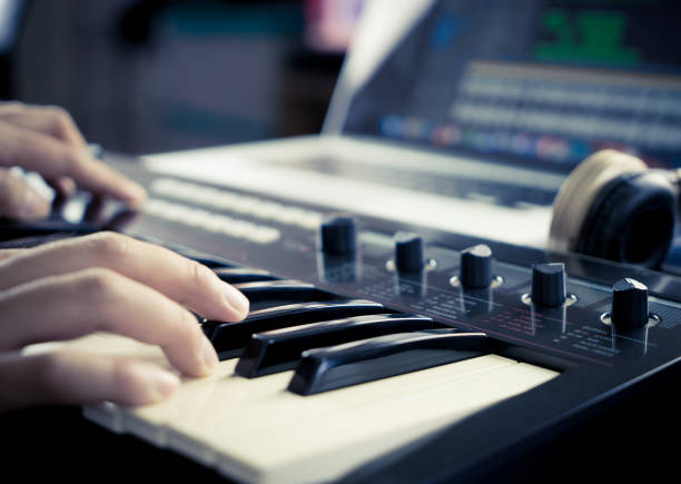 istock Music producer is working with Synthesizer and laptop 696658766