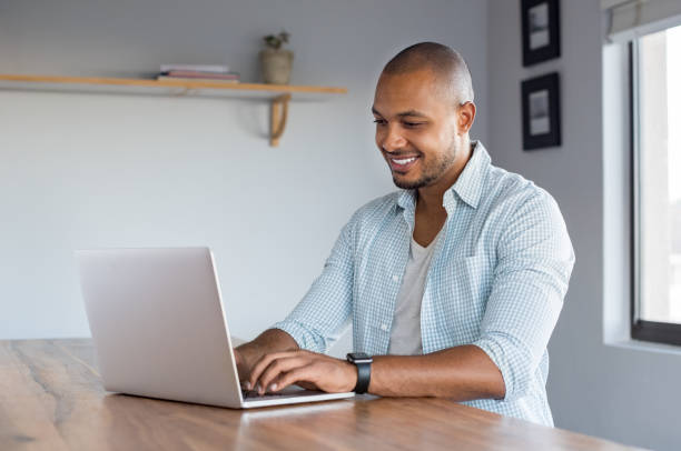istock Man working on laptop at home 696664818