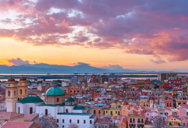 Sunset on Cagliari, evening panorama of the old city center in Sardinia Capital, view on The Old Cathedral and colored houses in traditional style, Italy stock photo