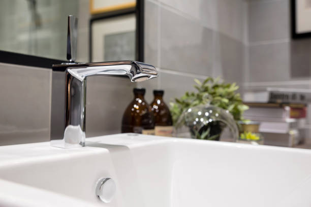 istock Modern faucet and wash basin in luxury bathroom 696666176