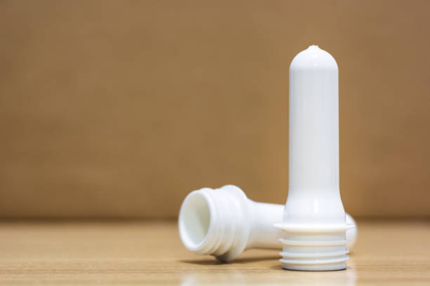 istock Two white preforms stand in front of brown background.jpg 696669370