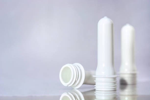 istock Group of white preforms stand on floor and white background 696669374