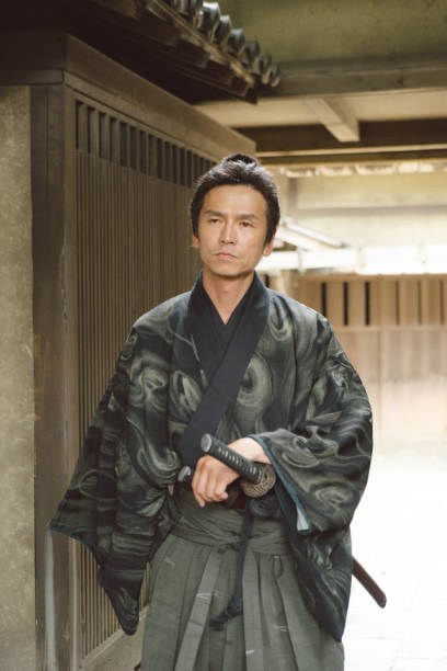 istock Samurai warrior walking through a traditional Japanese village 696673854