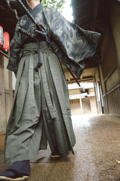 istock Samurai warrior walking through a traditional Japanese village 696676818