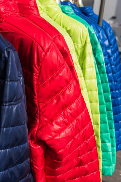 istock Winter clothes hanging at a store 696678048
