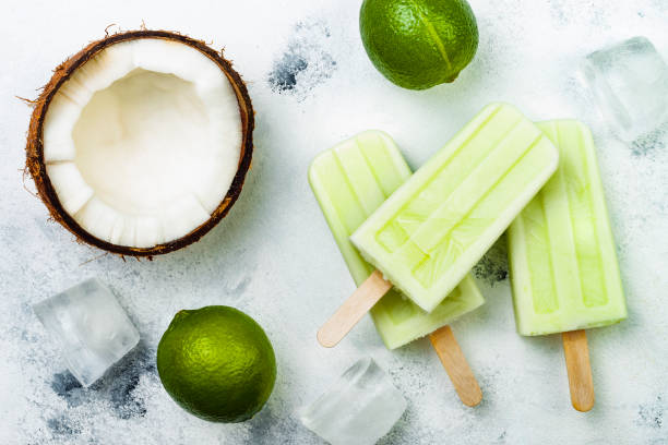homemade vegan frozen coconut mojito popsicles - ice pops - paletas with chia seeds - cocktail avocado imagens e fotografias de stock