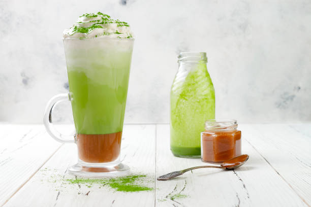 istock Matcha latte with salted caramel in tall glass. 696690088