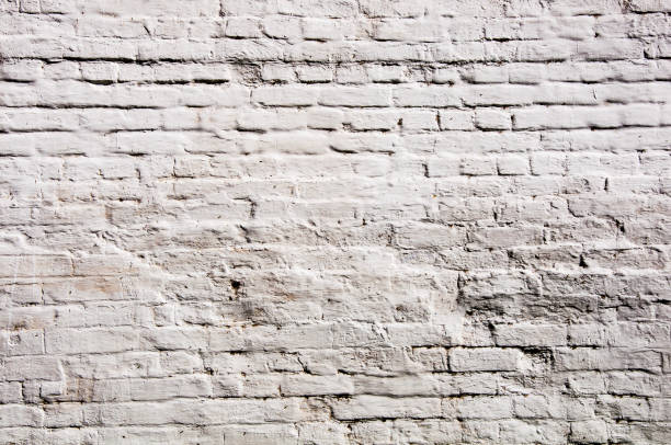 istock A surface of a white brick relief wall dyed in white colour 696696946