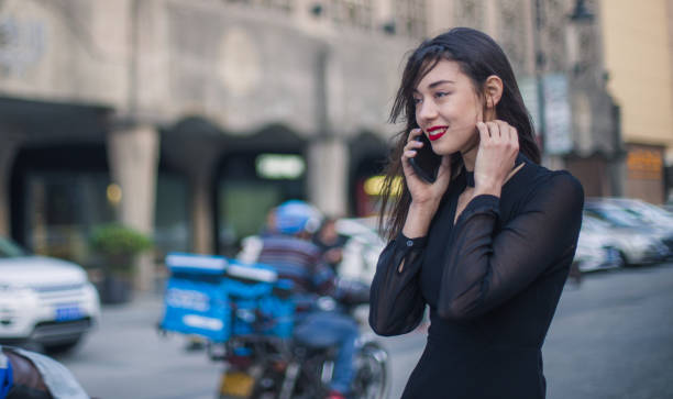 istock Modern girl talking on the phone 696698128