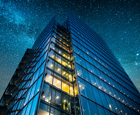 A beautiful office building at night. The building is part of a large group of office buildings situated near London's city hall building, United Kingdom.