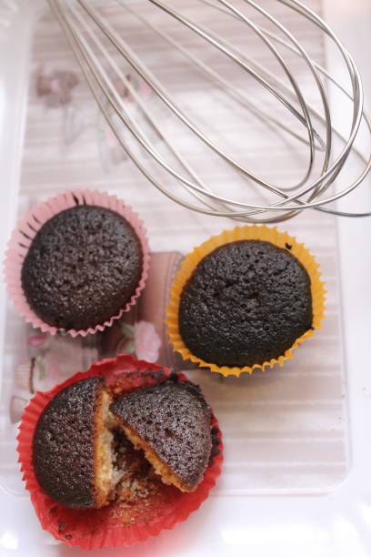 3 burned cakes 3 burned cakes, on a dessert plate with egg beater awful taste stock pictures, royalty-free photos & images