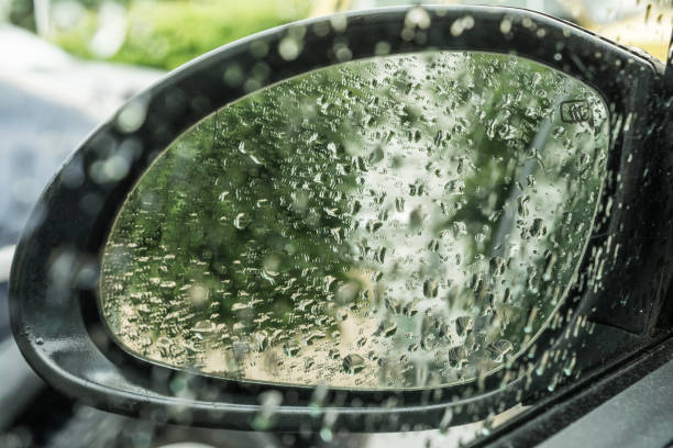istock Raindrops on the car's rear view mirror 696712634