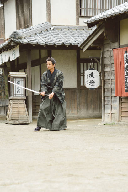 istock Samurai warrior in traditional Japanese village 696713398