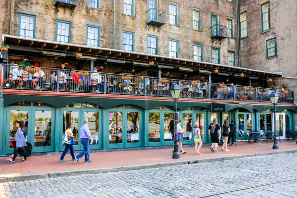People outside the River Street Inn pub and hotel in downtown Savannah Georgia, USA stock photo