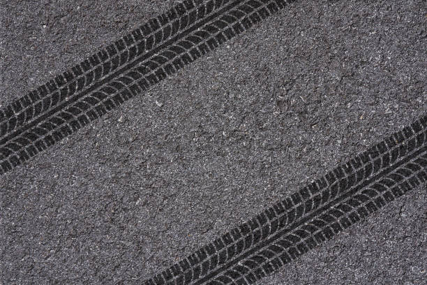 tire track on asphalt tire tread pattern on asphalt background street skid marks stock pictures, royalty-free photos & images