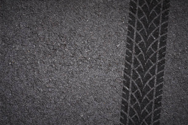 tire track on asphalt tire tread pattern on asphalt background street skid marks stock pictures, royalty-free photos & images