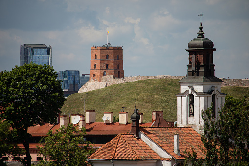 Vilnius old town cityscape with Gediminas castle and modern office buildings, Lithuania