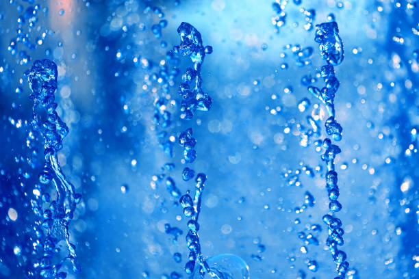 istock drops blue water of the fountain 696740310