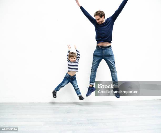 Happiness Family Stock Photo - Download Image Now - White Background, Jumping, Father