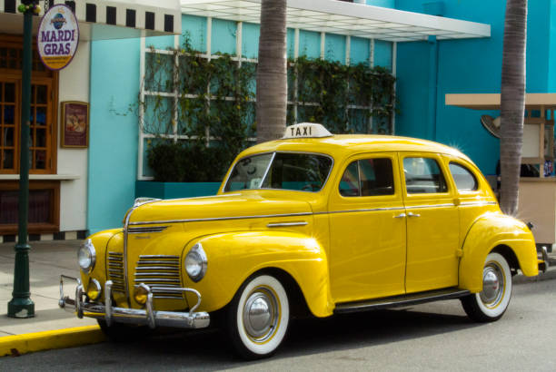 Orlando, Florida, USA - March 9, 2016: Vintage car parked on the roadside waiting for the guests, Classic cars are allowed to park at yellow line.
