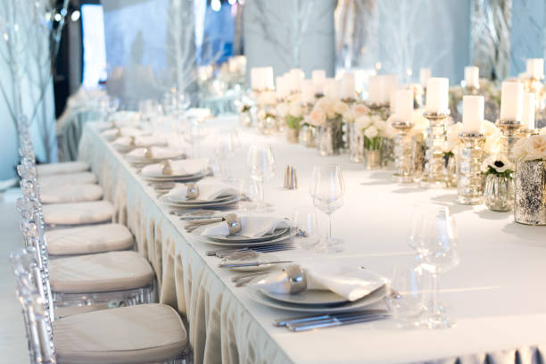 istock Banquet table decor. Candles in vases and flowers 696753594