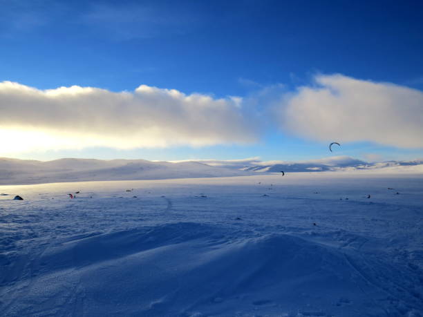 istock Wind surfing and snowkiting in winter 696753816