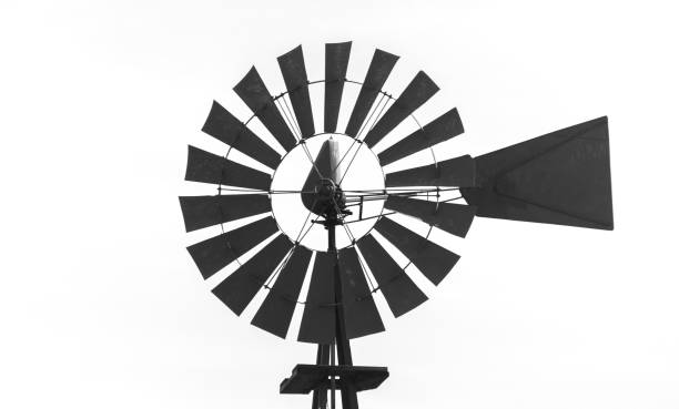istock Metal wind mill on a farm in the suburbs 696756536