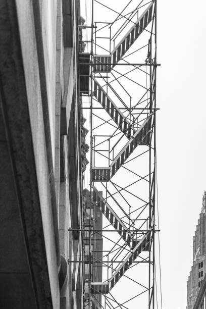 istock Construction metal ladder next to the building 696756692