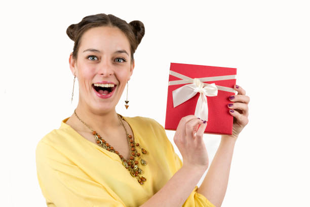istock Pretty young girl holding a gift box. 696759756