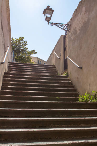 istock Old stairs in the streets of Alghero 696760006