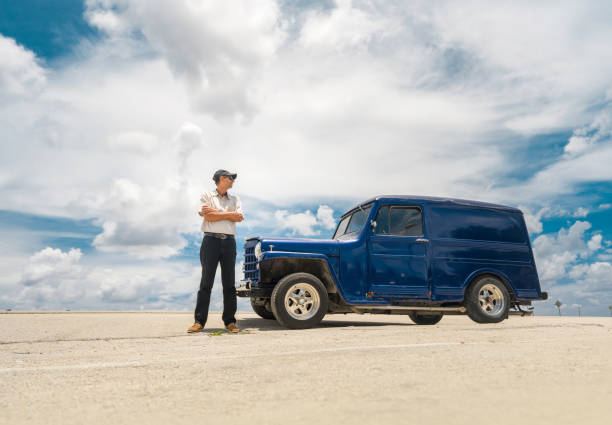 istock Man with vintage truck 696762846