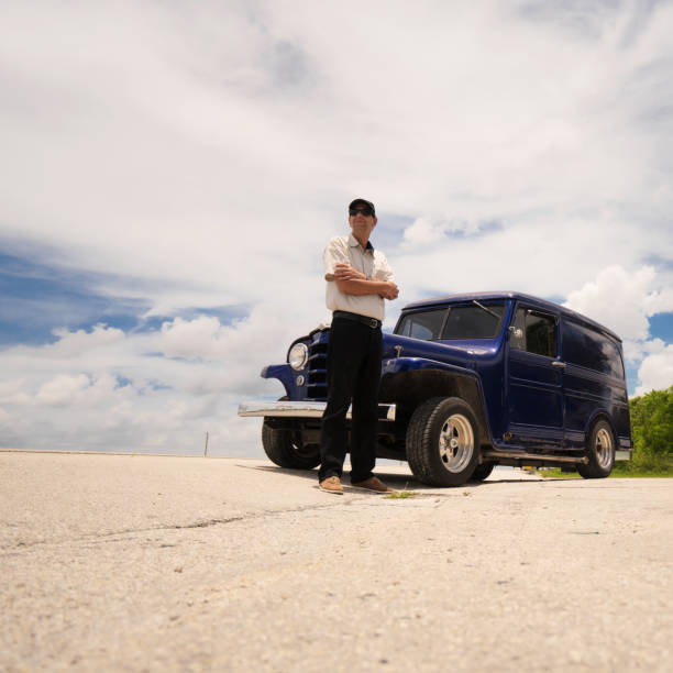 istock Man with vintage truck 696762946