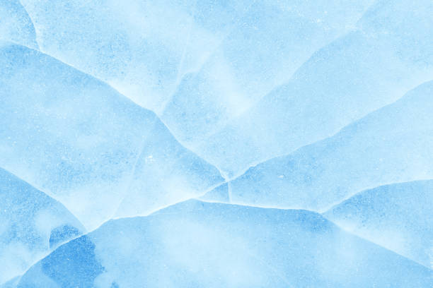istock ice background texture. ice with different shapes and cracks. 696770386
