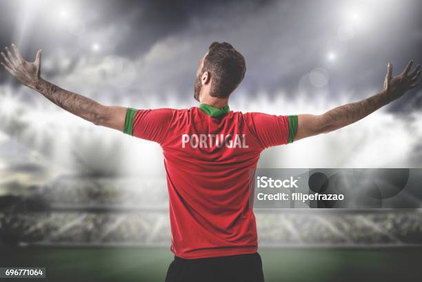 Portuguese Fan Sport Player On Uniform Celebrating Stock Photo - Download Image Now