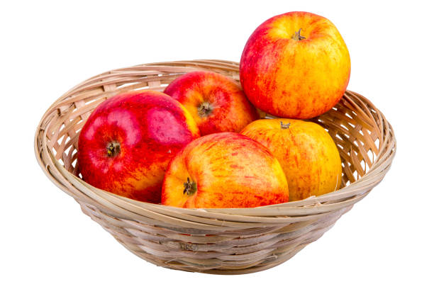 istock Wicker basket with apples on a white background 696771318