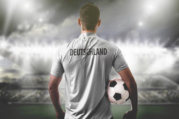 istock Geman Fan / Sport Player on uniform celebrating 696771424