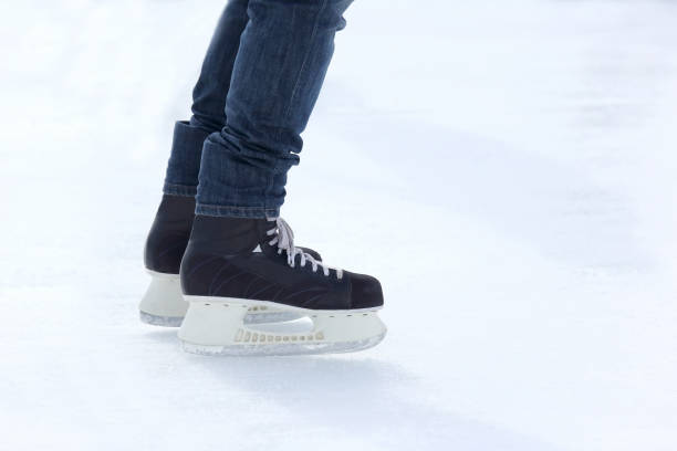 istock feet skating on the ice rink 696777994
