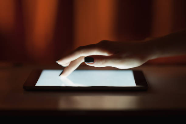 istock Female hand touching digital tablet, text messages, video calls, holidays to work, using the Internet 696783956