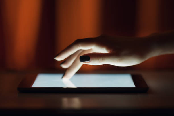 istock Female hand touching digital tablet, text messages, video calls, holidays to work, using the Internet 696783964