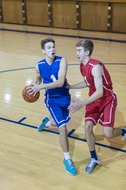 istock Boys high school basketball game 696785004