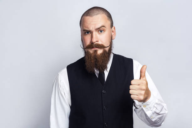 istock Handsome businessman  with thumbs up. 696794236