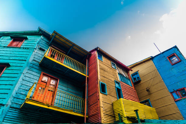 Traditional colorful houses on Caminito street in La Boca neighborhood, Buenos Aires Orange, red, blue, and yellow traditional South America houses la boca stock pictures, royalty-free photos & images
